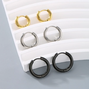 Three pairs of round stainless steel hoop earrings in gold, silver and black finishes