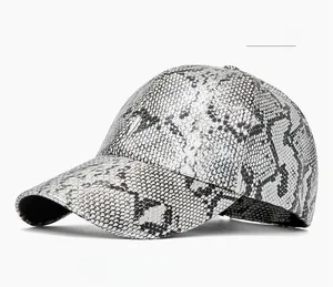 Close-up of metallic silver snake pattern texture on a stylish PU leather baseball cap