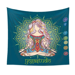 Detail of meditation tapestry showing seven chakras and woman in yoga pose on blue background