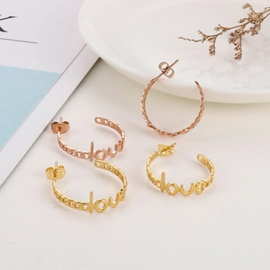 Retro stainless steel C-shaped hoop earrings with LOVE lettering in gold and rose gold