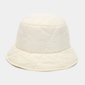Detailed close-up of cream quilted puffer bucket hat showing soft fabric and stitching