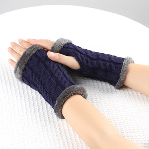 Detail of navy knit fingerless gloves with cable pattern and grey faux fur trim