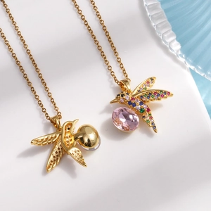 Golden hummingbird pendant necklace with vibrant colorful cubic zirconia and pink gemstones