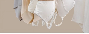 Neutral seamless cotton bras in gray and beige with adjustable straps on hanger