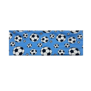 Close-up of blue sports headband featuring classic black and white soccer ball patterns