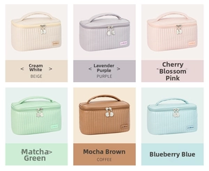 Detailed grid view of quilted PU cosmetic bags in six pastel colors with top handles