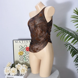 Macro detail of brown sheer mesh tank top with one-shoulder design and ruched floral pattern