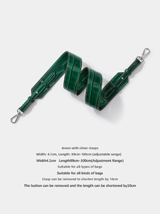 Detail of adjustable green crocodile pattern leather strap with silver hardware, 4.1cm width