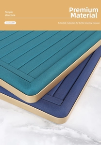 Detailed close-up of velvet jewelry display trays with gold frame and ring slots