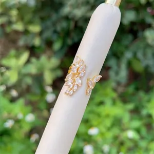 Detail of adjustable 18K gold plated leaf ring with marquise cut zircon stones