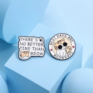 Cute cartoon cat enamel pins set featuring humorous meow-themed slogans on blue blocks