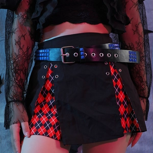 Detail of a punk Y2K black skirt with red plaid and a blue studded metal rivet belt