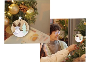 Close-up of 3D wooden Christmas tree ornaments with reindeer and snowman figures
