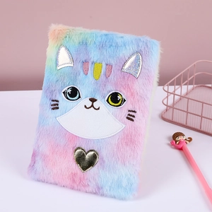 Detail of cute rainbow faux fur notebook with cat ears and embroidered kitten face