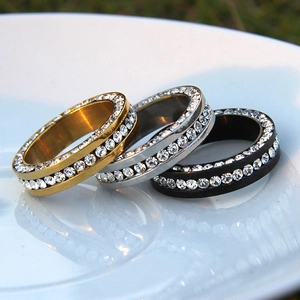 Detailed macro view of 6mm triple-layer eternity rings in gold, silver, and matte black