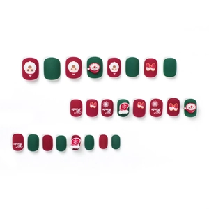 Short matte Christmas press-on nails featuring cute Santa Claus and snowflake designs
