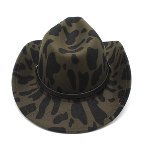 Close-up of the dark green cow print felt texture and black leather band on the cowboy hat