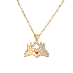 Gold plated heart necklace with MOM pendant and red zircon, professional white background
