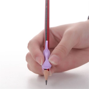 Close-up of purple silicone pencil gripper for correct writing posture on a wooden pencil