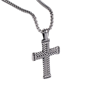 Silver stainless steel cross pendant necklace with textured pattern on a round box chain