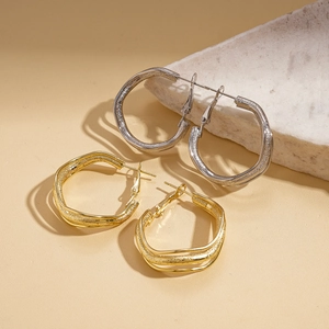 Irregular triple-layered wavy metal hoop earrings in matte gold and silver finish