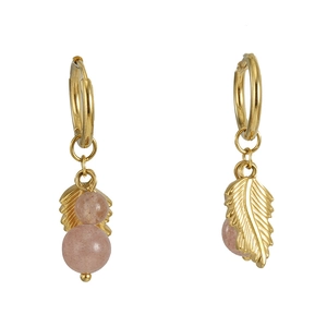 Detail of 18k gold earrings featuring a delicate leaf charm and natural pink stone beads