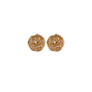 Elegant gold camellia stud earrings with diamond accents and hollow petal design