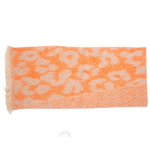 Detail showing the orange leopard print pattern and short tassel edges of the winter scarf