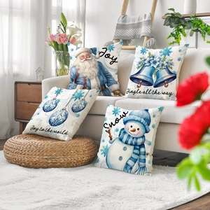 Set of four blue and white Christmas pillow covers with Santa and snowman patterns