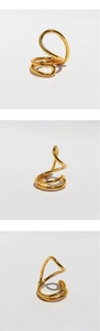 Detailed macro views of the multi-layered coiled gold metal ring from multiple angles