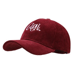 Classic corduroy baseball cap in deep red with white Gigi embroidery side view
