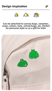 Detail of funny muscle frog enamel pins made of green alloy for clothing and bags