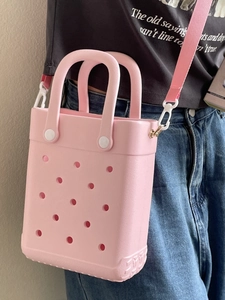 Pink EVA perforated tote bag for women with dual handles and adjustable shoulder strap