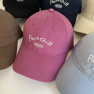 Detail of embroidered Paris Chill logo on various colored cotton baseball caps