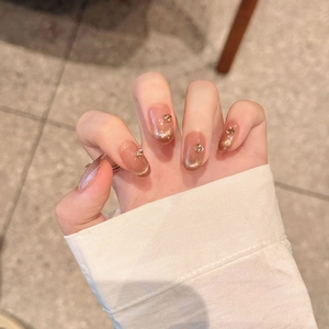 Mocha cat-eye press-on nails with French gradient and sparkling rhinestone accents