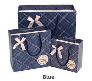 Three-size set of blue plaid paper gift bags with pink ribbon bows and rope handles