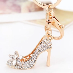 Detailed close-up of a rose gold high heel keychain with sparkling crystals