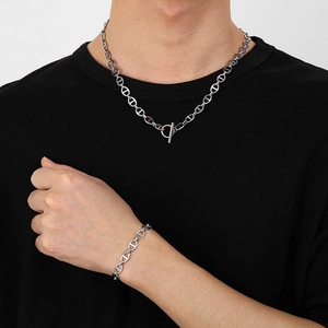 Silver stainless steel pig nose chain necklace and bracelet set on a model