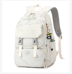 Detail of cute bear print and functional buckles on beige school backpack for girls