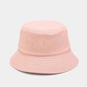 Close-up of a pink cotton bucket hat showing detailed fabric texture and fine stitching
