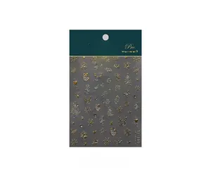 Close-up of TL-107 Christmas nail art stickers featuring 5D embossed snowflakes and elk