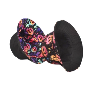 Reversible bucket hat with black solid side and colorful skull star pattern design