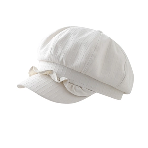 Lace brim newsboy cap in cream white linen fabric featuring a ruffled visor and cloud shape