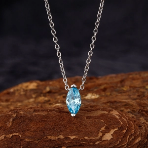 S925 Sterling silver necklace featuring a marquise cut sea blue zircon pendant on wood