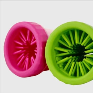 Portable silicone dog paw cleaner cup with soft bristles in vibrant pink and green