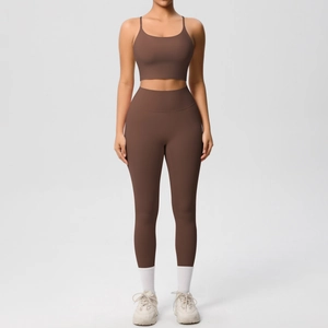 Brown two-piece yoga set featuring spaghetti strap sports bra and high waist leggings