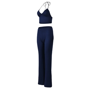 Deep blue two-piece set featuring thin strap crop top and matching straight-leg trousers