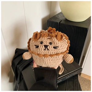 Close-up of handmade crochet lion bag featuring soft yarn texture and cute animal design