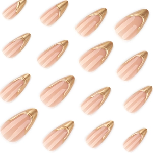 French almond press-on nails with nude pink base and 3D metallic gold tips design
