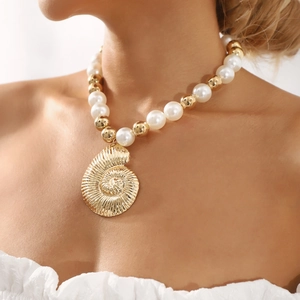 Mixed faux pearl and gold bead necklace with oversized hollow conch shell pendant